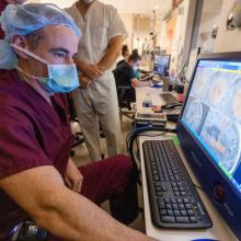 Doctor viewing brain images on screen