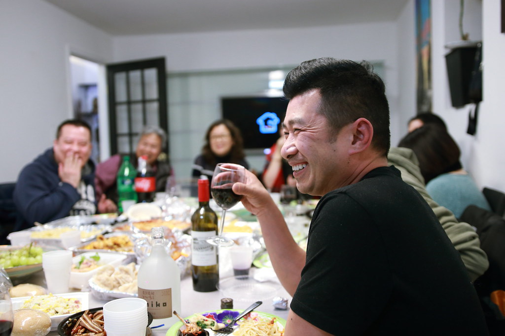 Friends laughing around a table