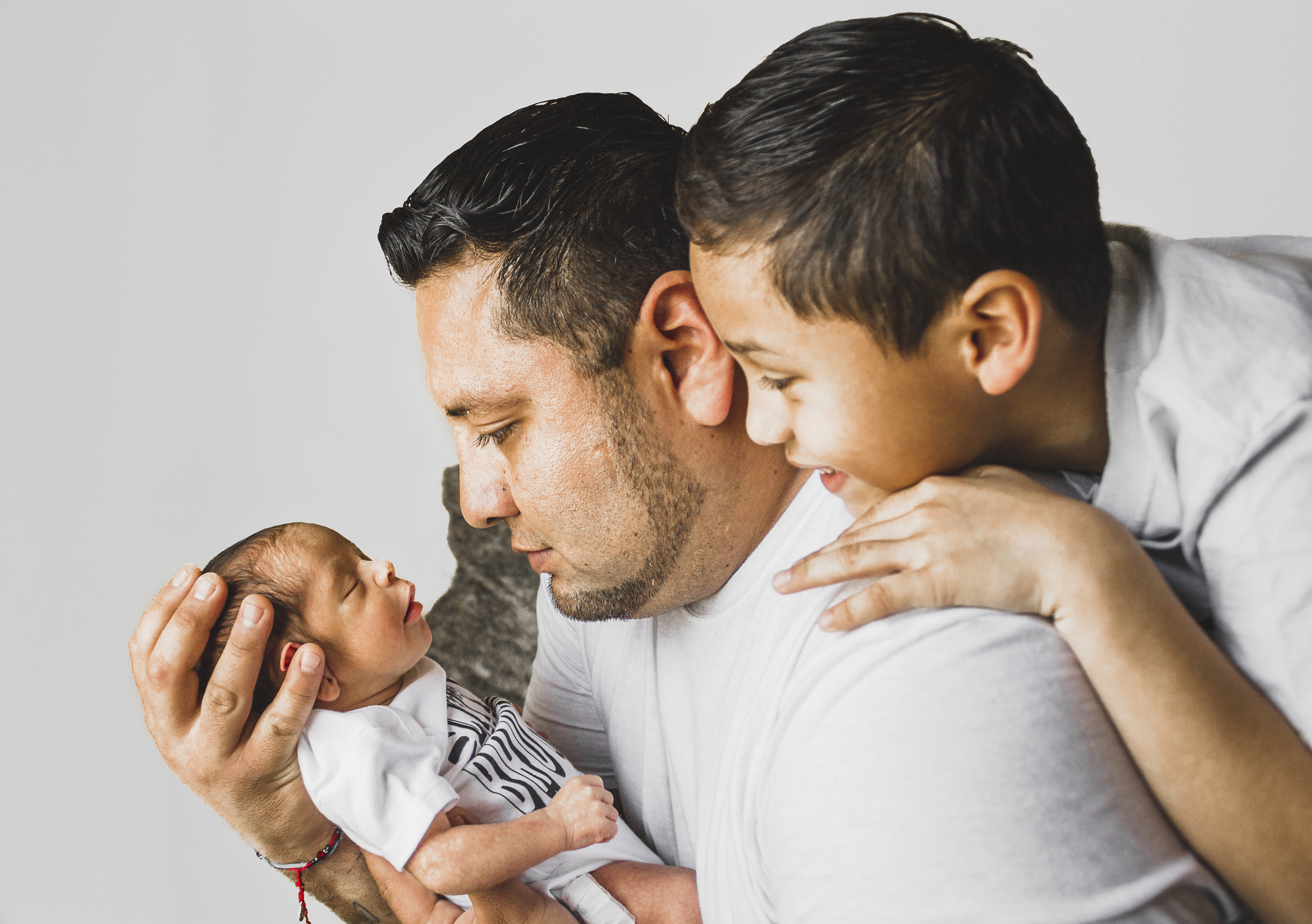 Photo Of Man Carrying Newborn Baby