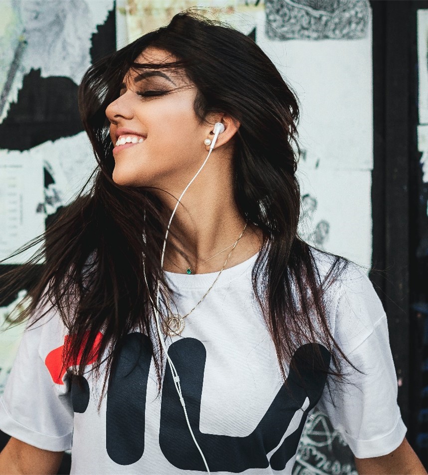 Woman listening to music on earbuds