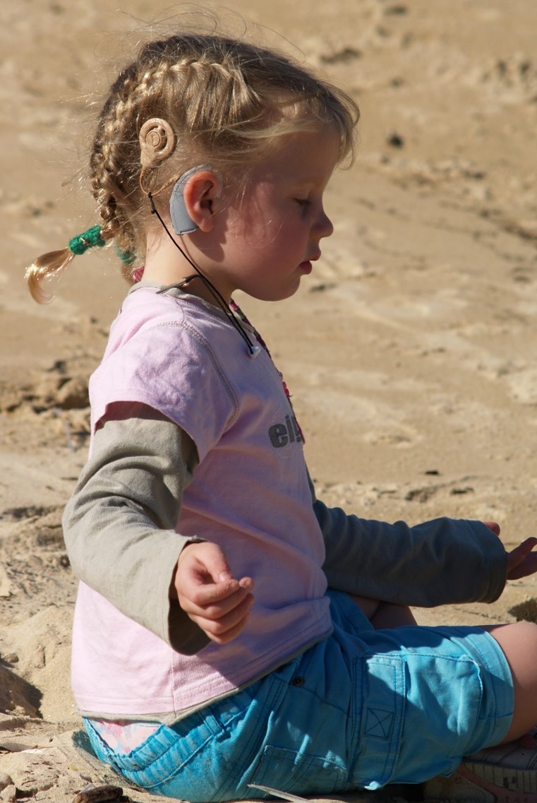 Child wearing a cochlear implant