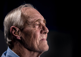 Older adult with hearing aid