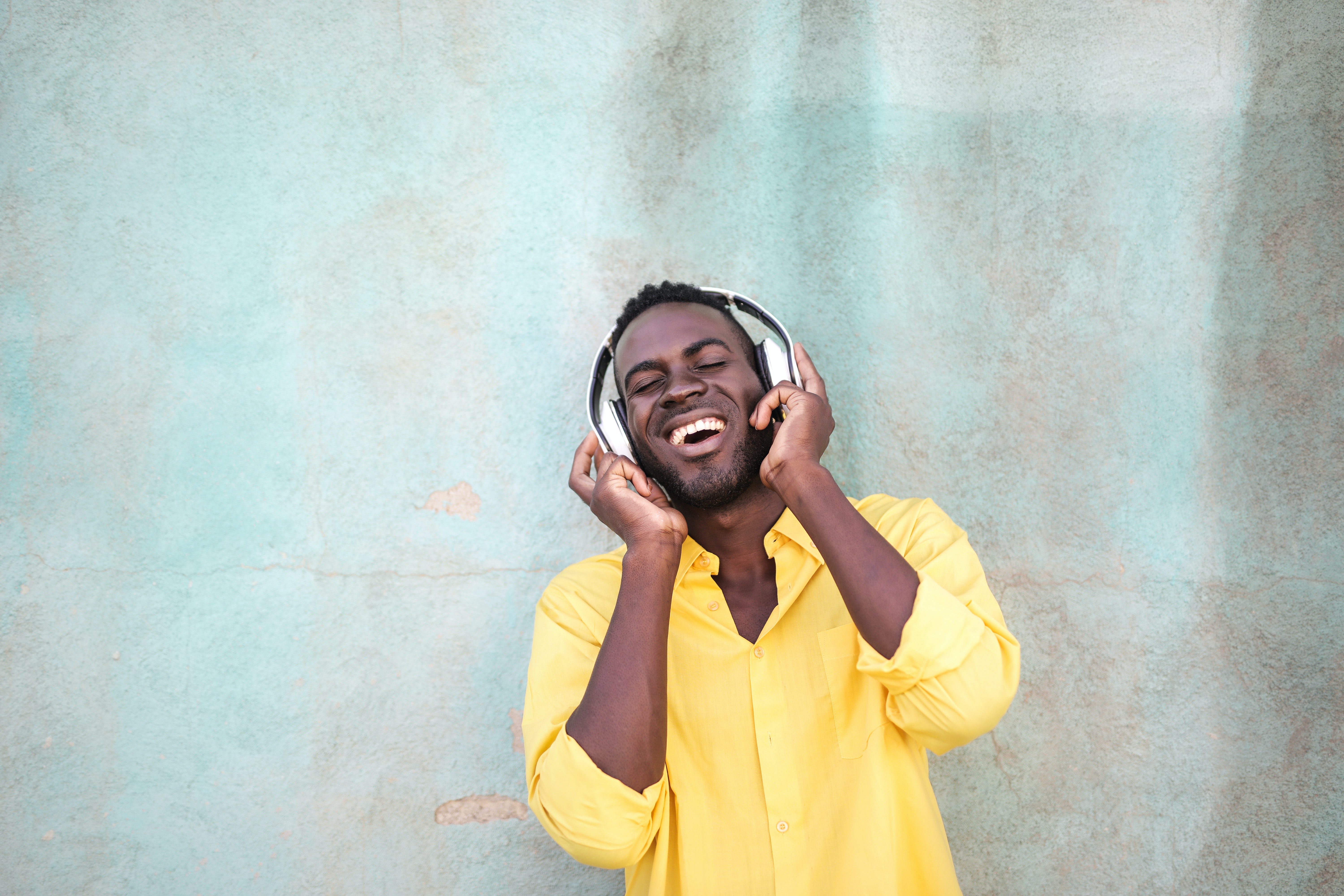 Man listening through headphones