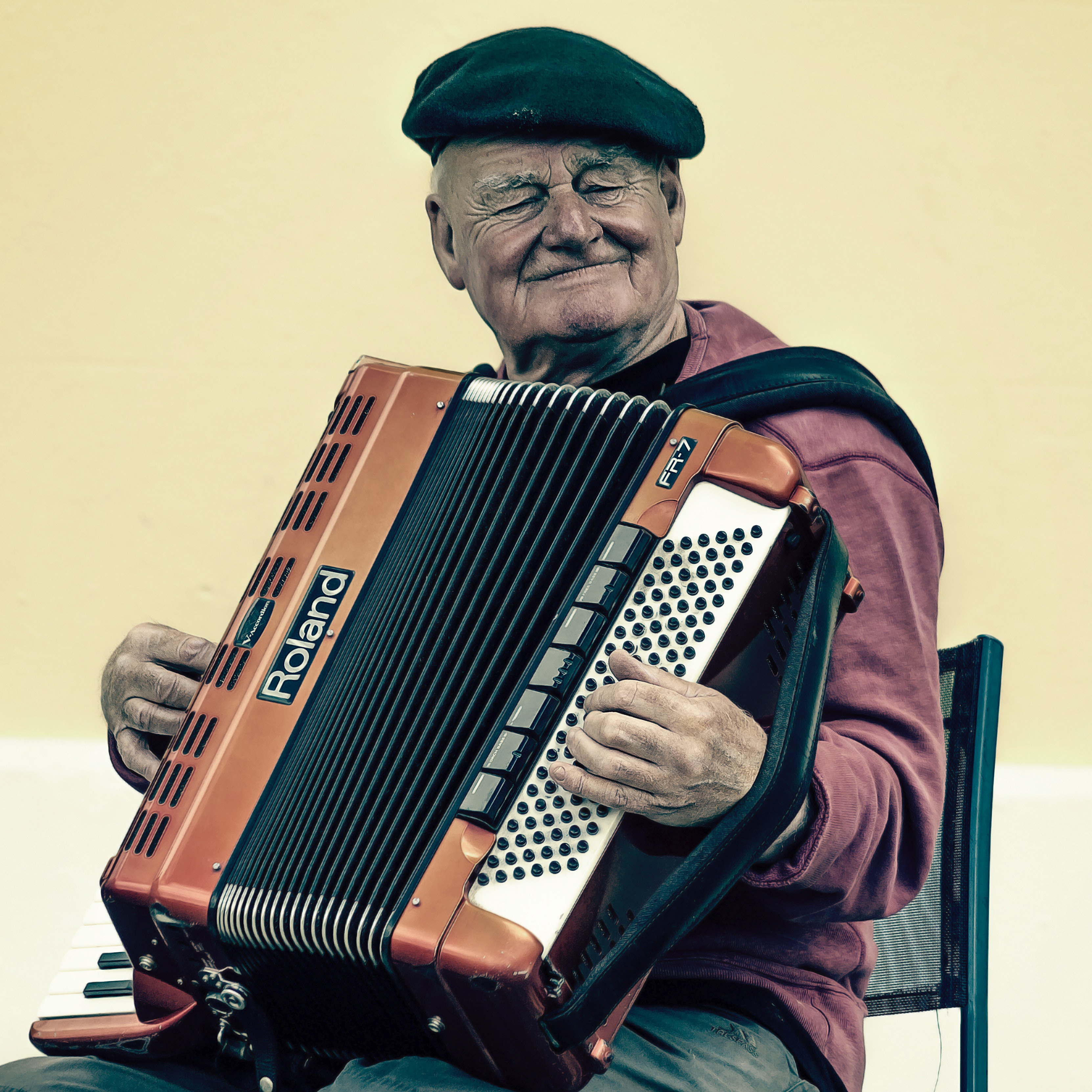 Older man playing accordion
