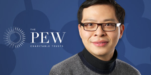 Photo of Qi Wu with Pew Scholar banner