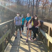 Hiking: Fellows hiking at Woodpecker Trail in Iowa City.