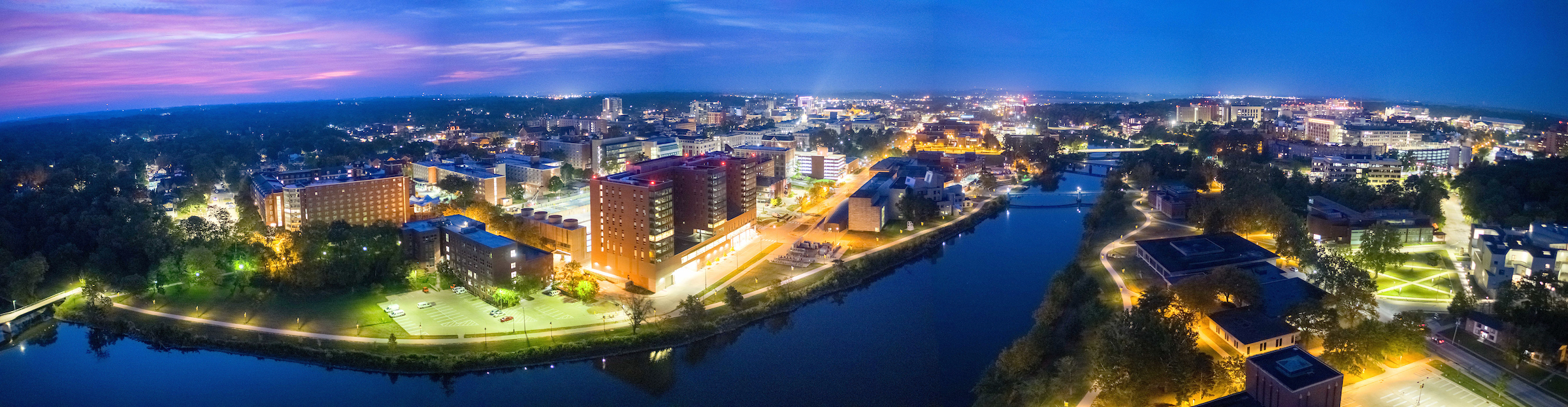 Aerial photo of the campus on the Iowa River at sunrise