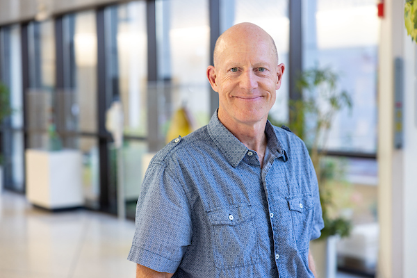 Daniel Tranel pictured smiling inside the Medical Education Research Facility.