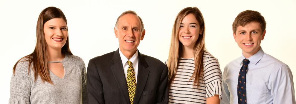 Pictured left to right are Miranda Schene, Brooks Jackson, dean of the Carver College of Medicine, Allyson Merfeld, and Marshall Moyer 