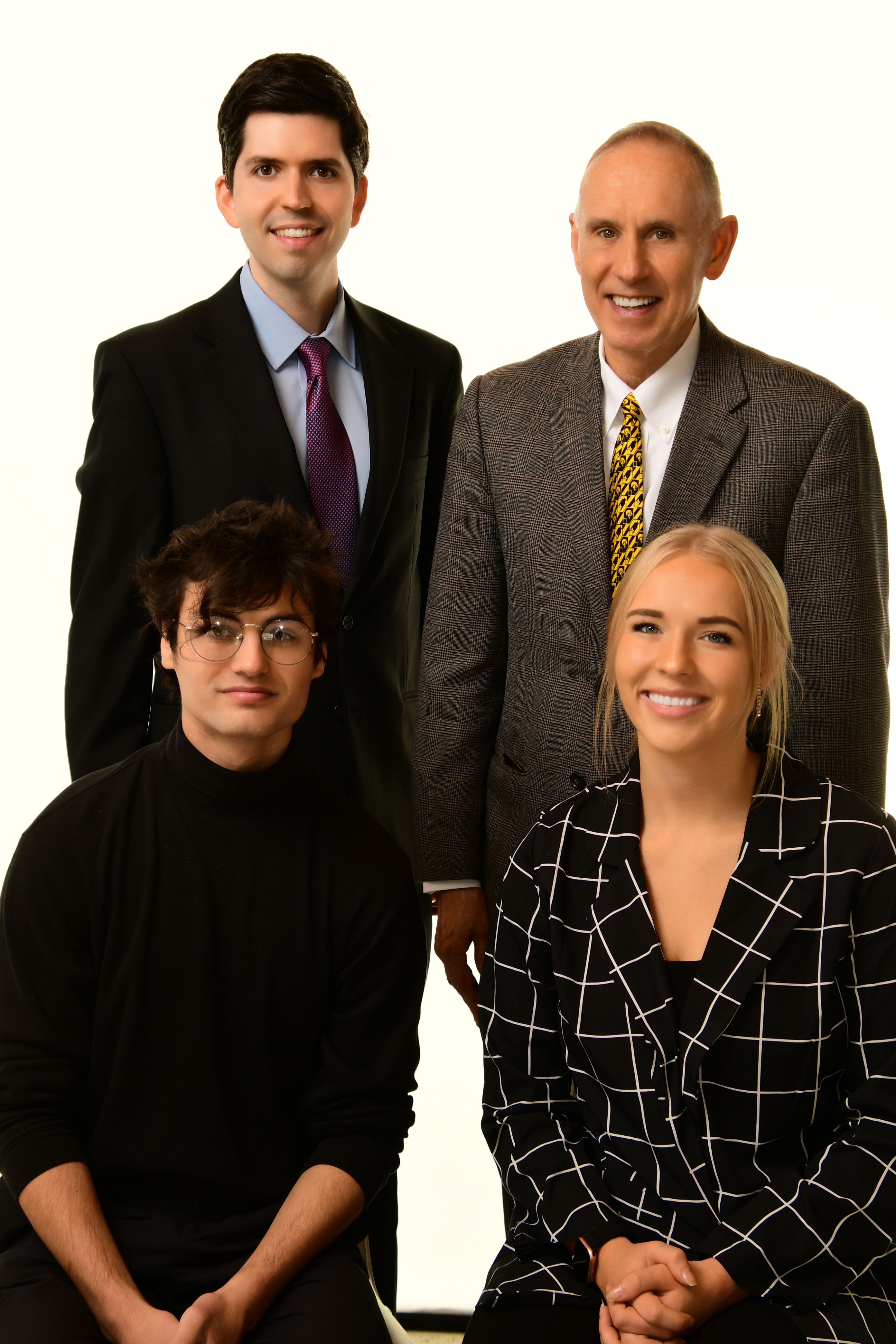 Dr. Brooks Jackson and the three winners of the student poetry contest