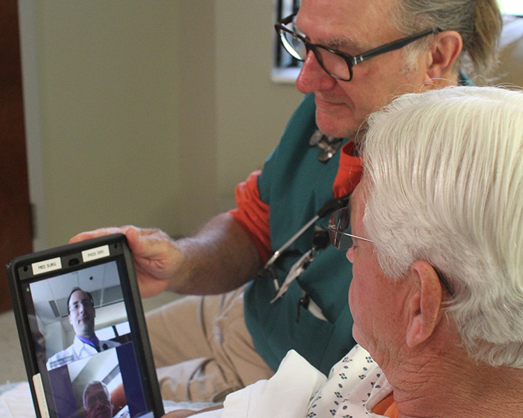 Doctor and patient conferring with a UI hospitalist