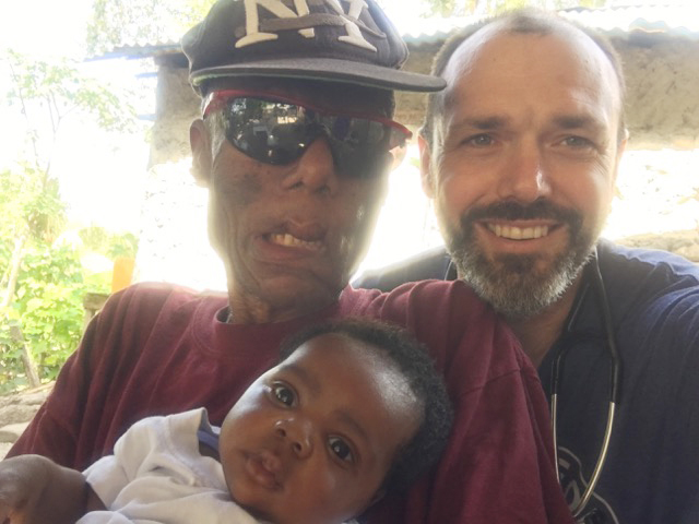 Chris Buresh with family in Haiti