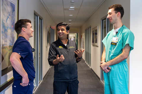 Manish Suneja, MD, is pictured with former resident physicians and current UI faculty members Taylor Cox, MD, (left) and Reed Johnson, MD