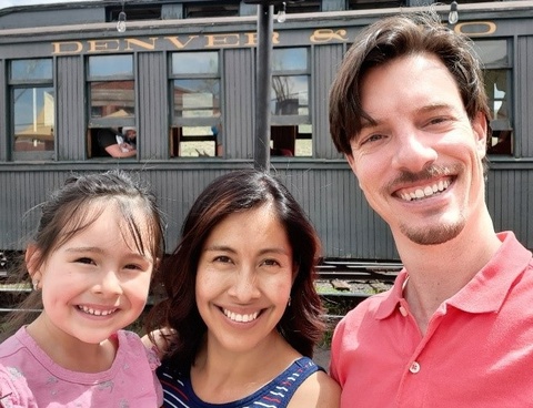 John Buckner with his wife, Veronica, and their young daughter, Maria.