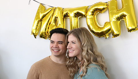 couple under match sign