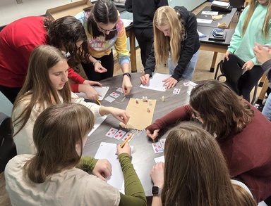 Ahmann leads students through a synthetic blood-typing activity during her visit to Western Dubuque High School in December 2025.
