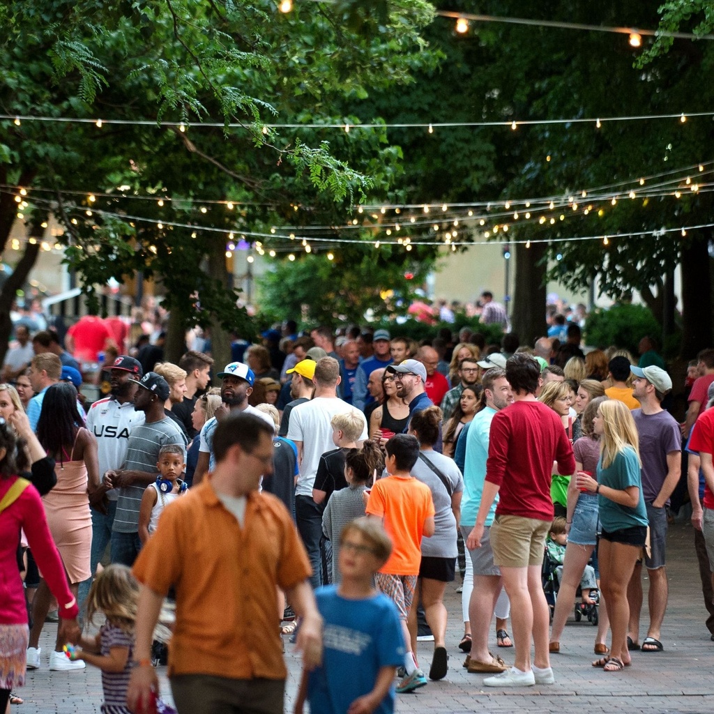 People gathered on the Pedestrian Mall for the Iowa City Downtown Block Party