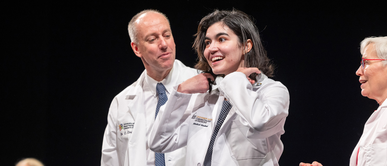 Carver College of Medicine Class of 2027 medical students receive their white coats during the white coat ceremony at Hancher Auditorium on Friday, August 11, 2023.