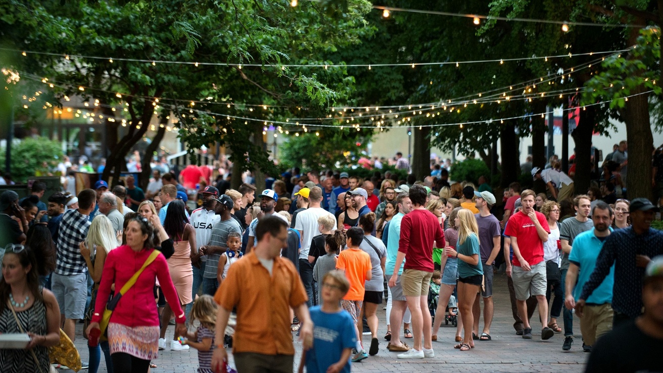 People gathered on the Pedestrian Mall for the Iowa City Downtown Block Party