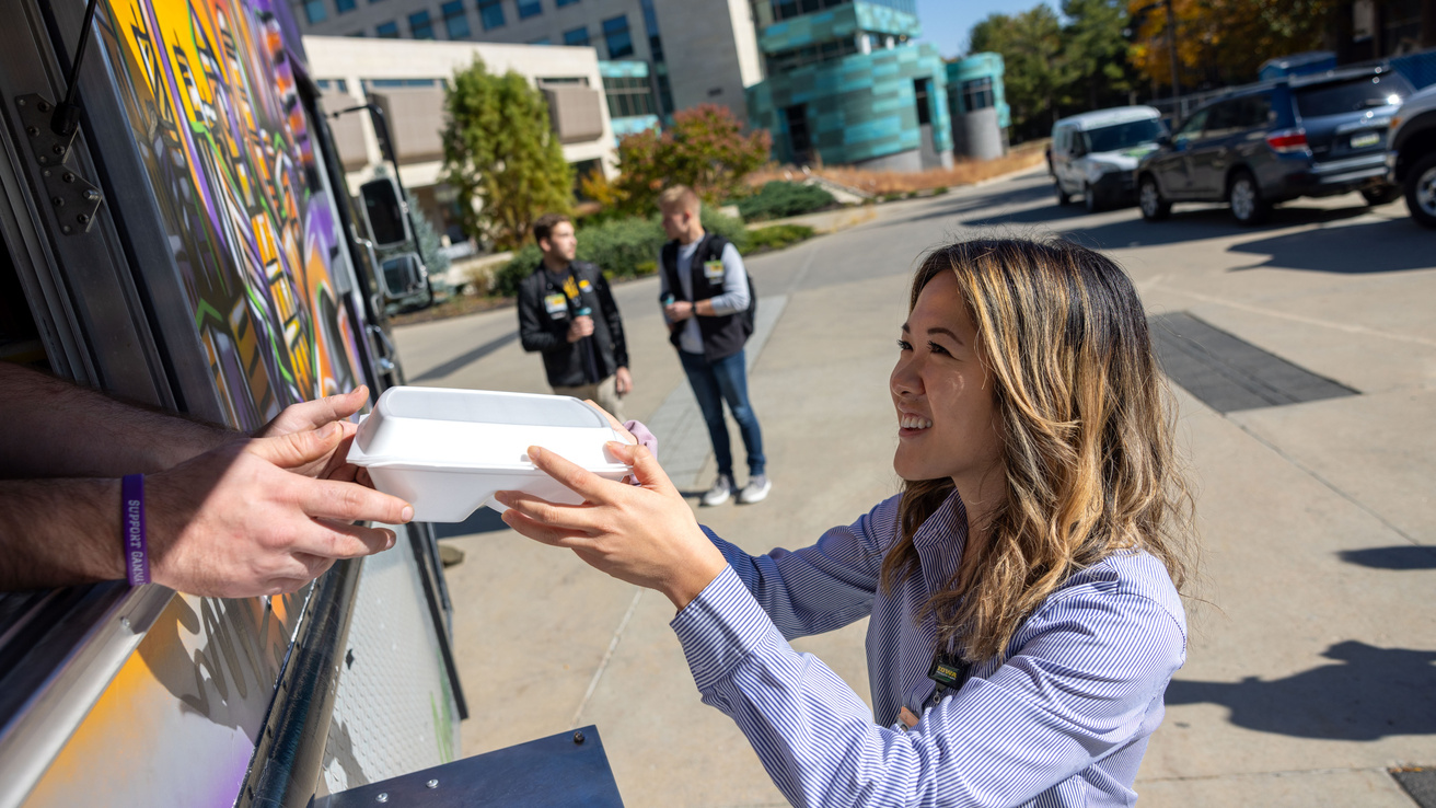 Medical students Michelle Chen, Harrison Parker, Spenser Larson on the Carver College of Medicine campus with fall foliage on Thursday, Oct. 24, 2024.