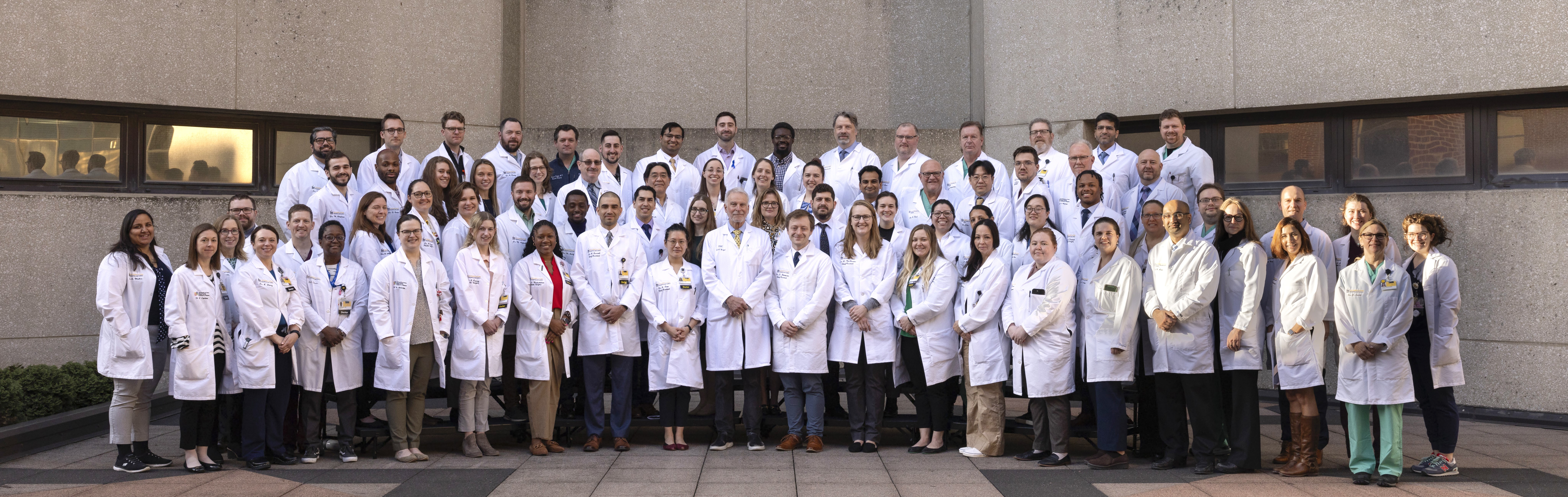 Medical students and residents, in the surgical residency training program, work under the supervision of the surgical staff as they make their rounds.